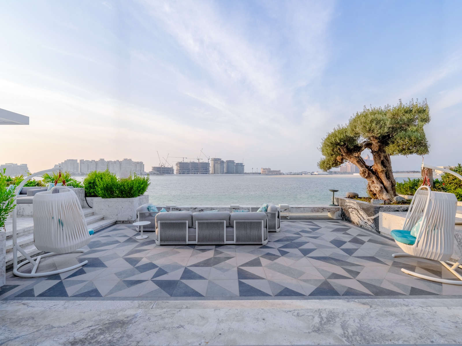 Outdoor living terrace with geometric tiles