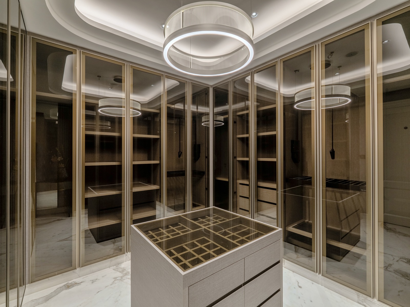 Walk-in closet with glass cabinetry