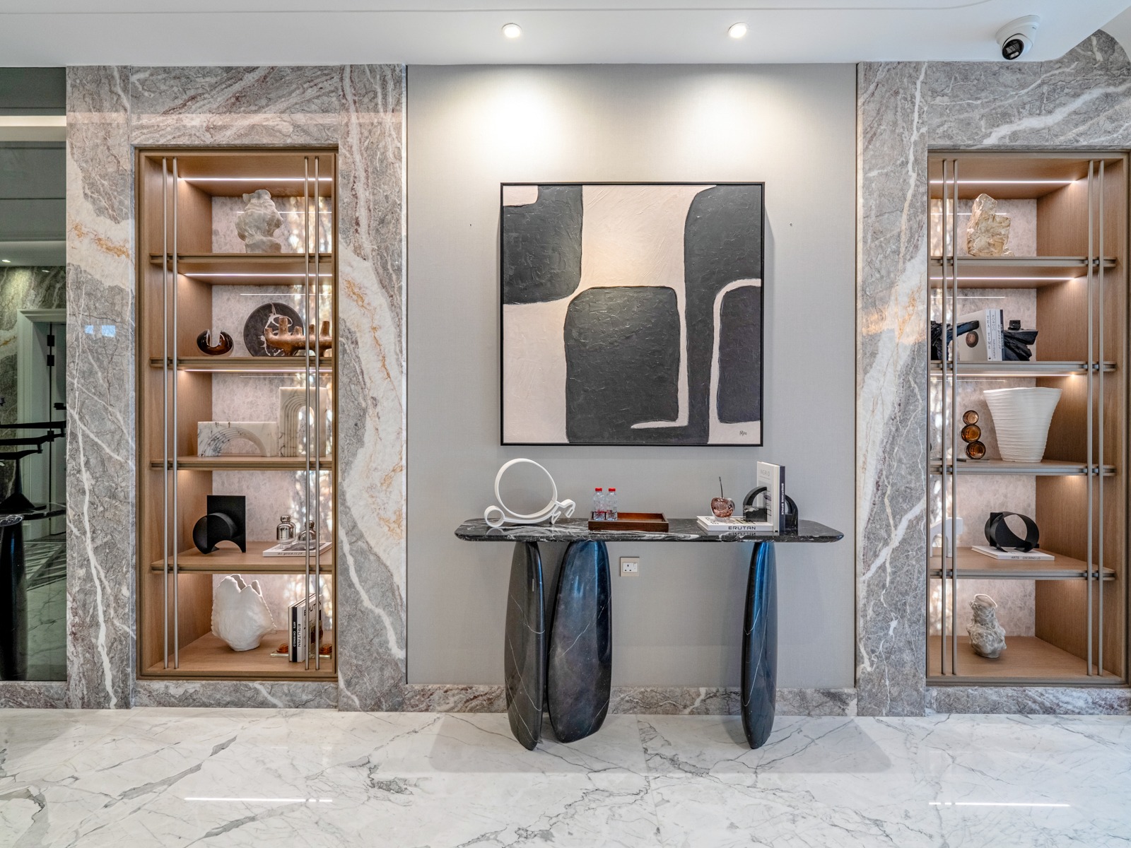 Hallway with marble display niches and art