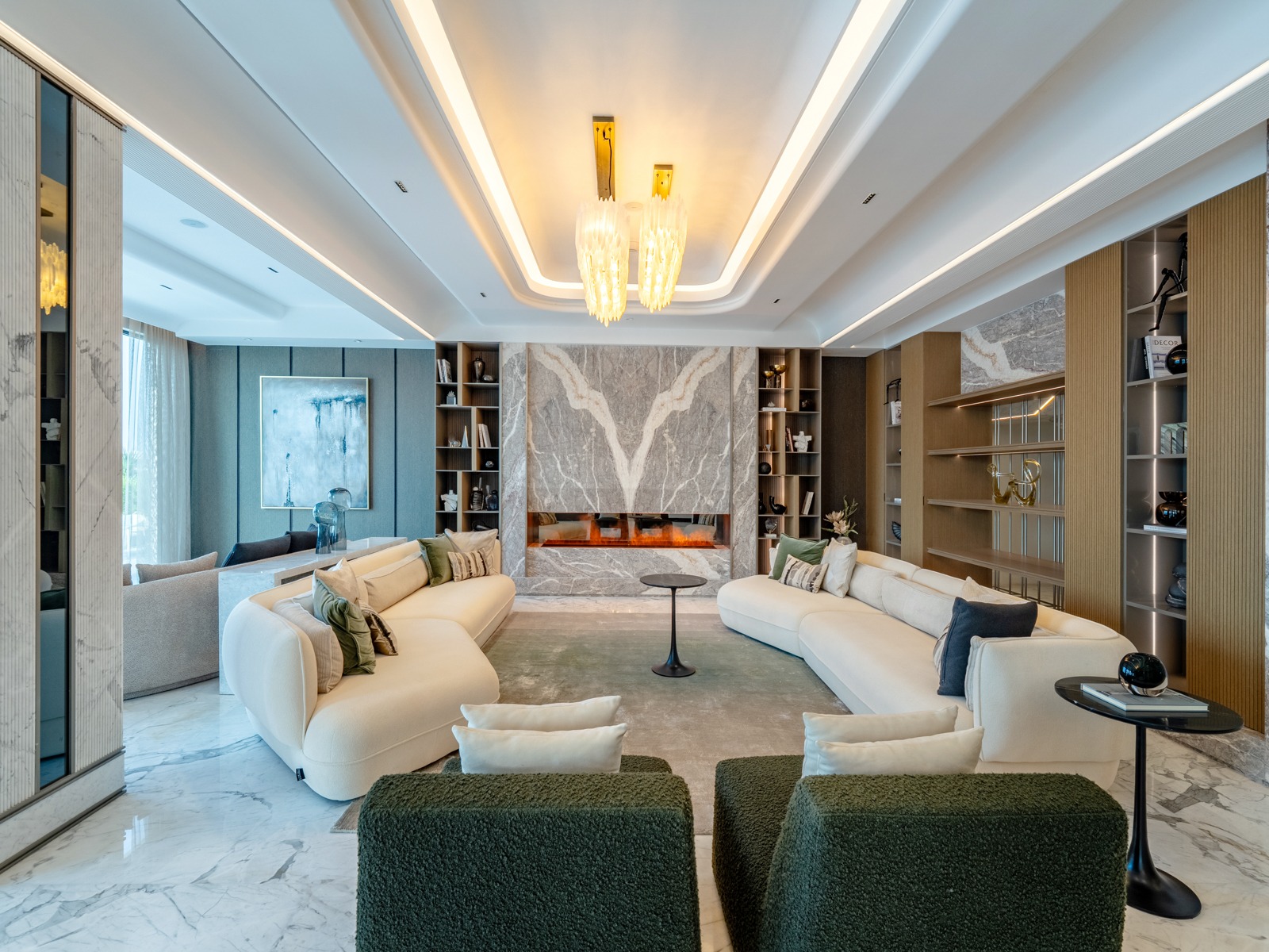 Living room with bookmatched marble fireplace